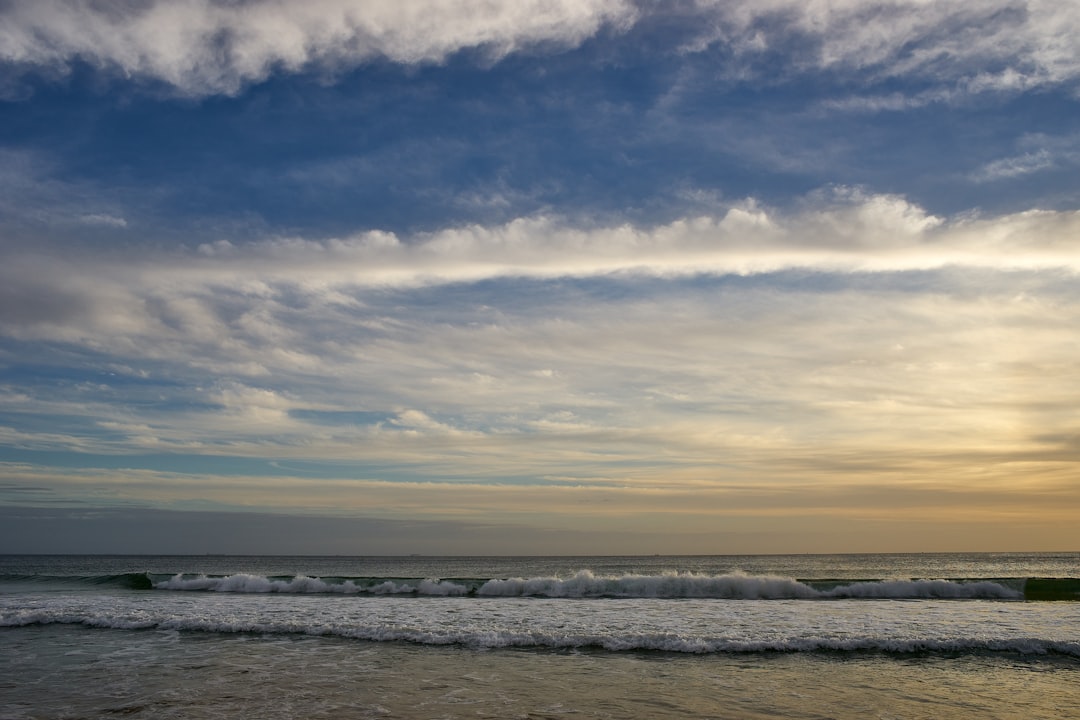 ocean under cloudy sky during daytime