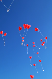 Children releasing balloons in memory of loved ones at a foundation ceremony.