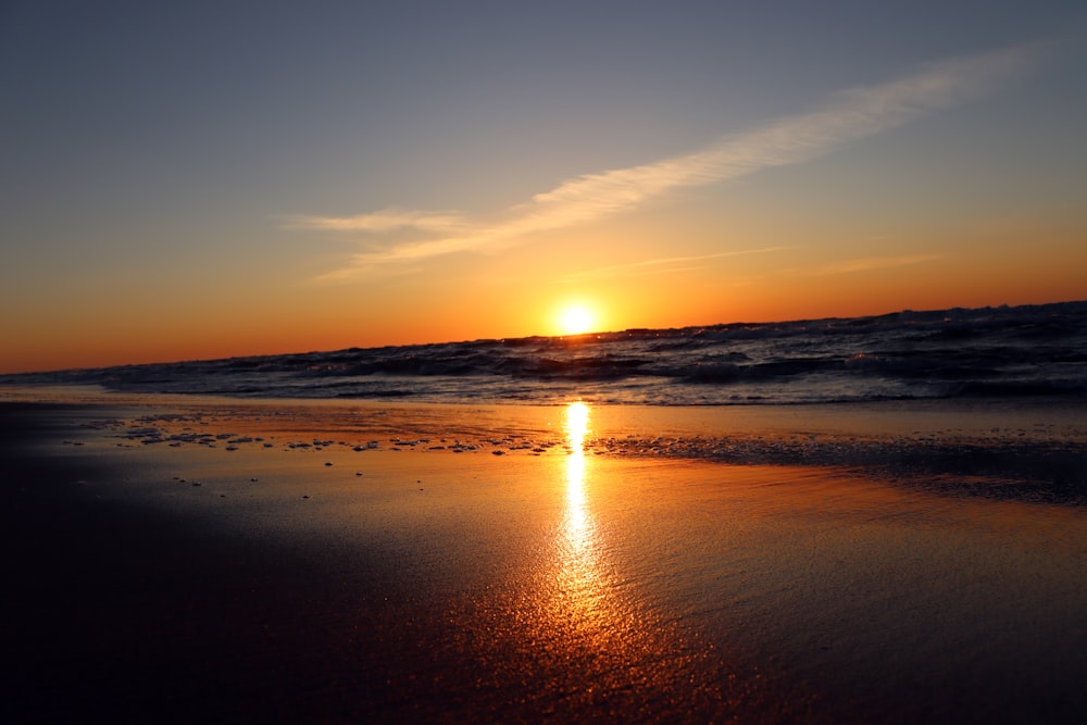 body of water during sunset