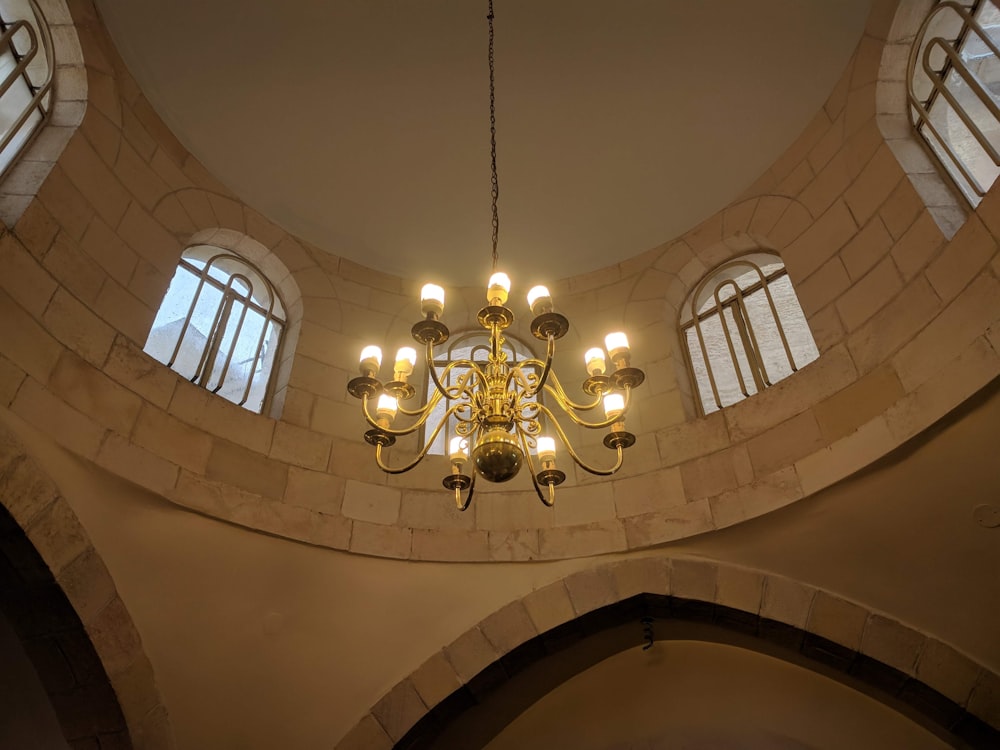 gold and white uplight chandelier