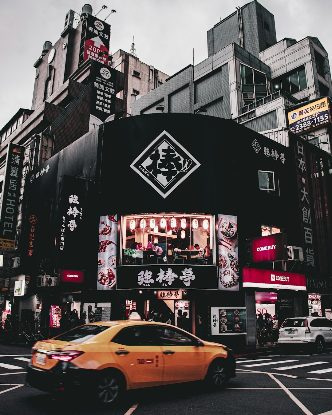 yellow taxi cab on street during daytime