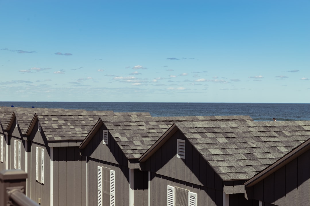 brown and white wooden houses under blue sky during daytime
