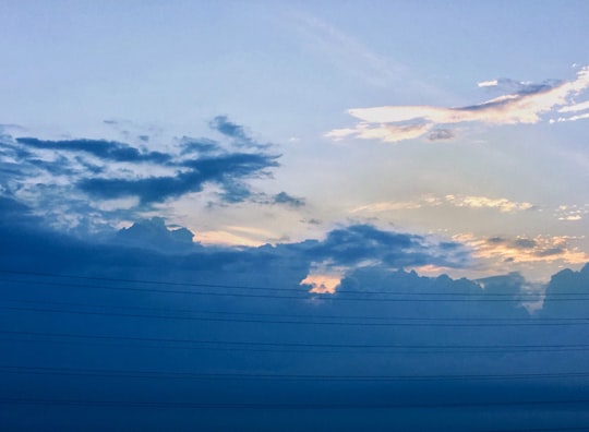 white clouds and blue sky during daytime in Ghaziabad India