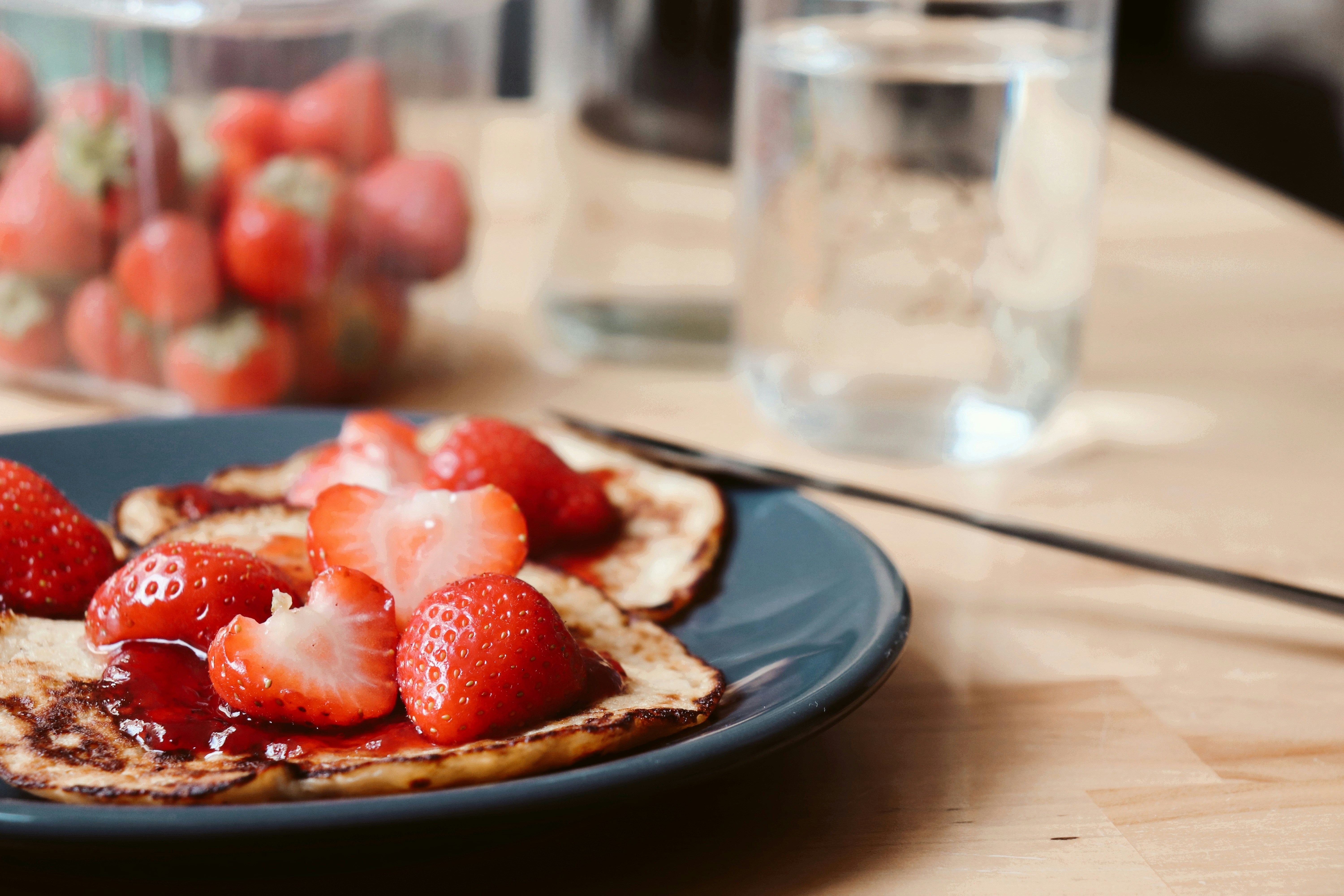 strawberry and blueberry on blue ceramic plate