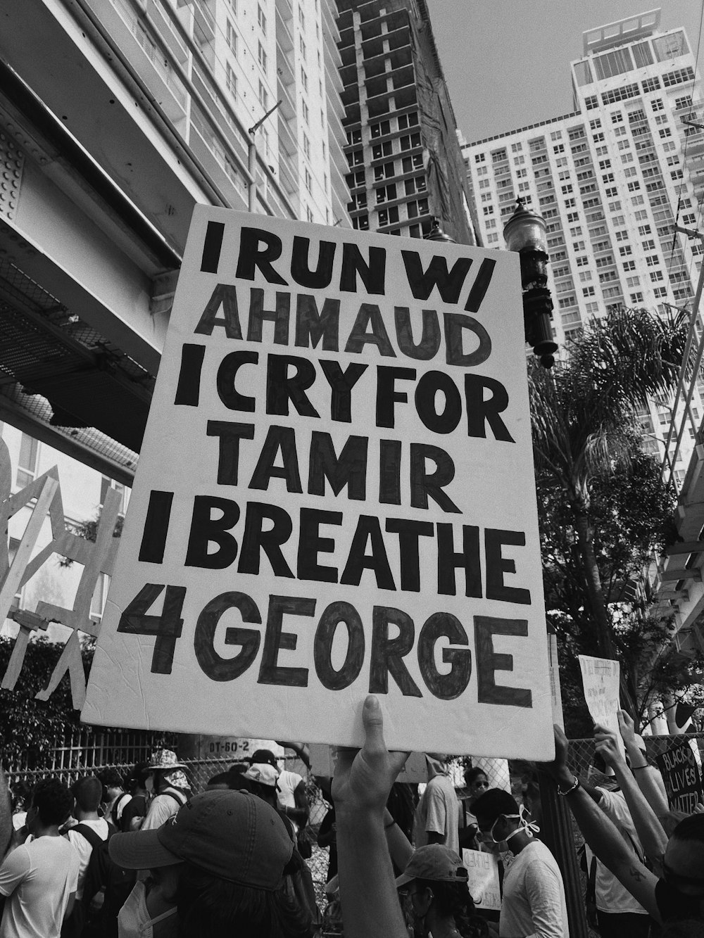 a group of people holding up a sign