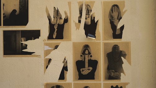 An old family photo torn in half, with a dark, moody background.