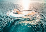 person surfing on sea waves during daytime