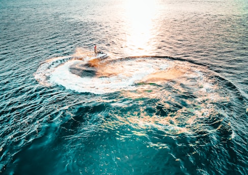 person surfing on sea waves during daytime