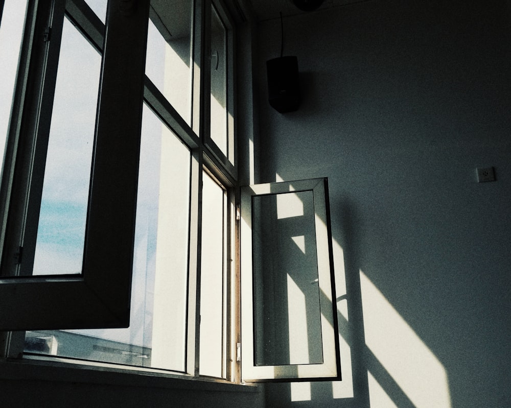 white wooden framed glass window