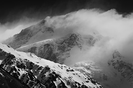 grayscale photo of mountain covered with snow in Mount Sefton New Zealand