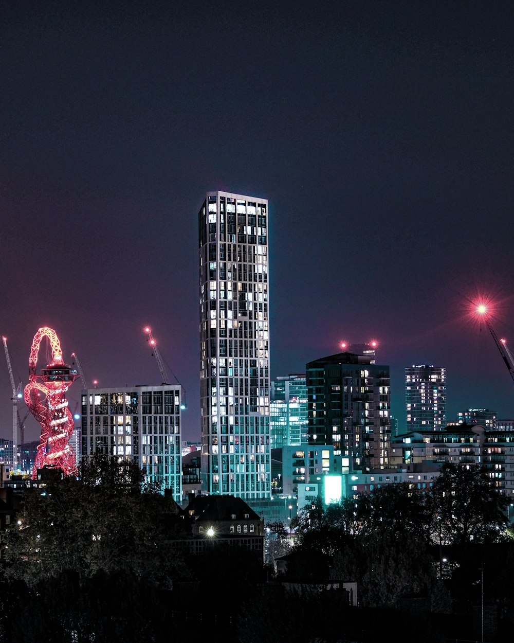 city with high rise buildings during night time