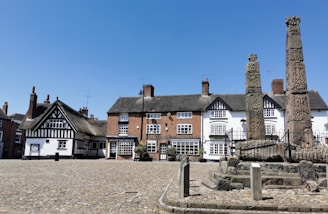 white and brown concrete house under blue sky during daytime