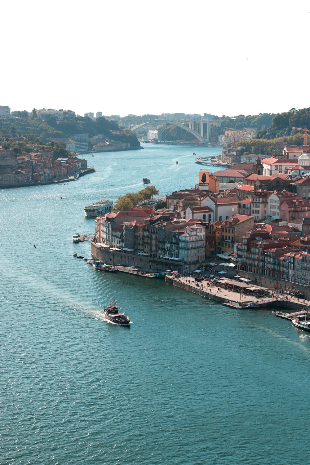 aerial view of city buildings beside body of water during daytime