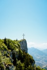 cross on top of mountain during daytime