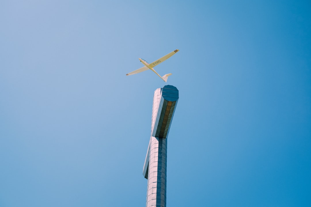 white and green windmill under blue sky during daytime