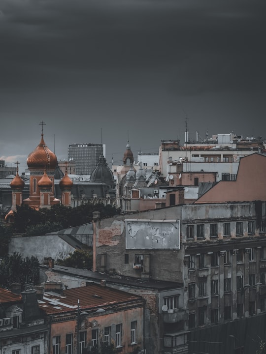 brown and white concrete building during daytime in Bucharest Romania