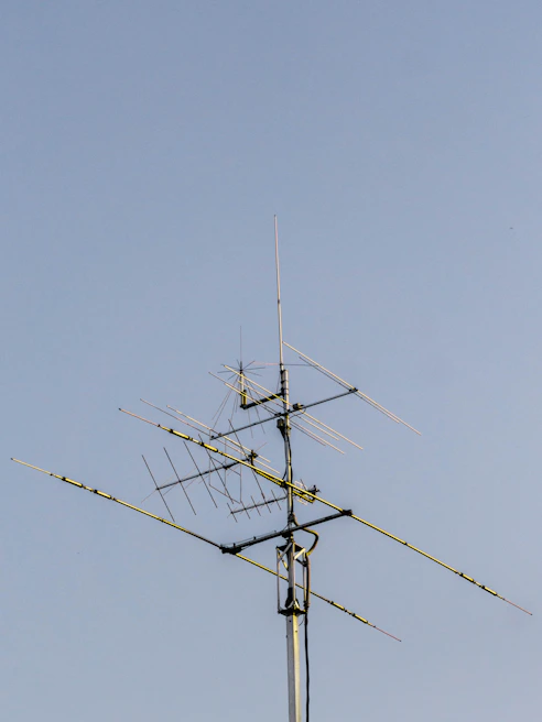 Various types of antennas displayed on a clean white surface.