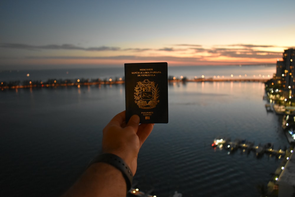 person holding black and white card