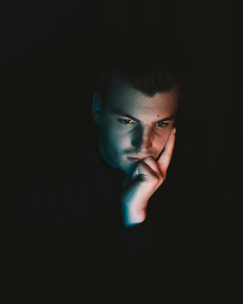 man in black shirt with blue eyes