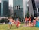 A group of children playing in a vibrant city park.