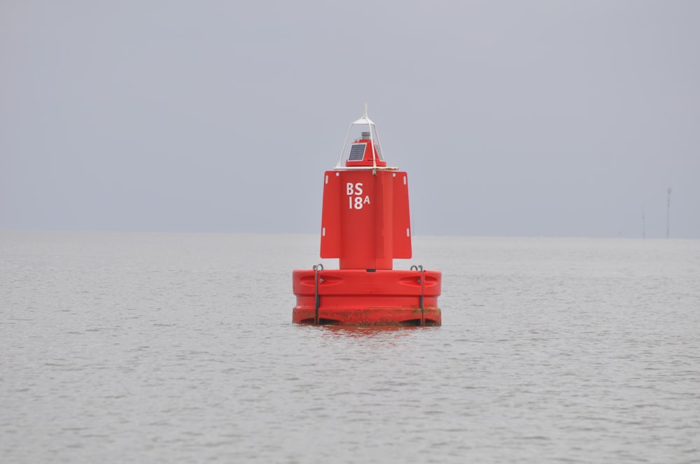 red and white ship on sea during daytime