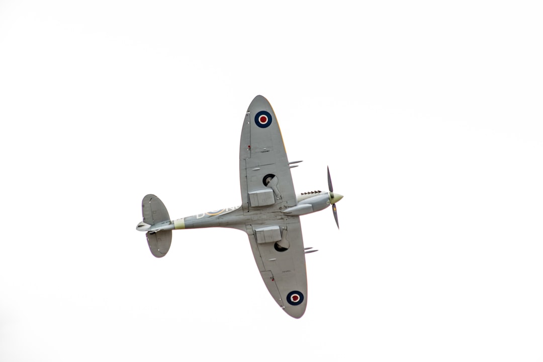 black and white airplane in mid air,