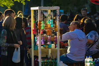 man in white crew neck t-shirt holding bottle