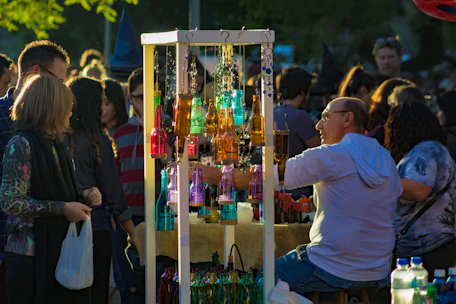man in white crew neck t-shirt holding bottle