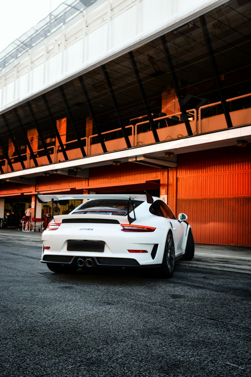 white porsche 911 parked on parking lot