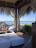 Guests relaxing in the private lounge area of their surf camp room.