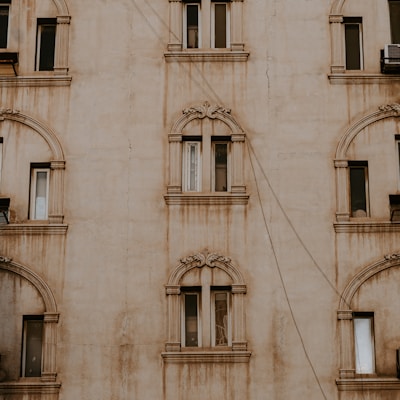 brown and white concrete building during daytime