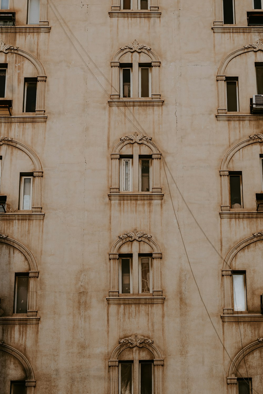 brown and white concrete building during daytime