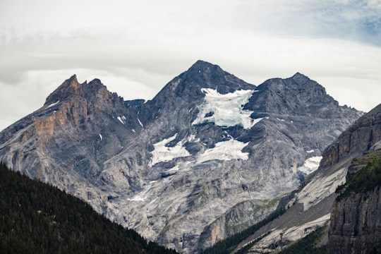 snow covered mountain during daytime in Oeschinensee Switzerland