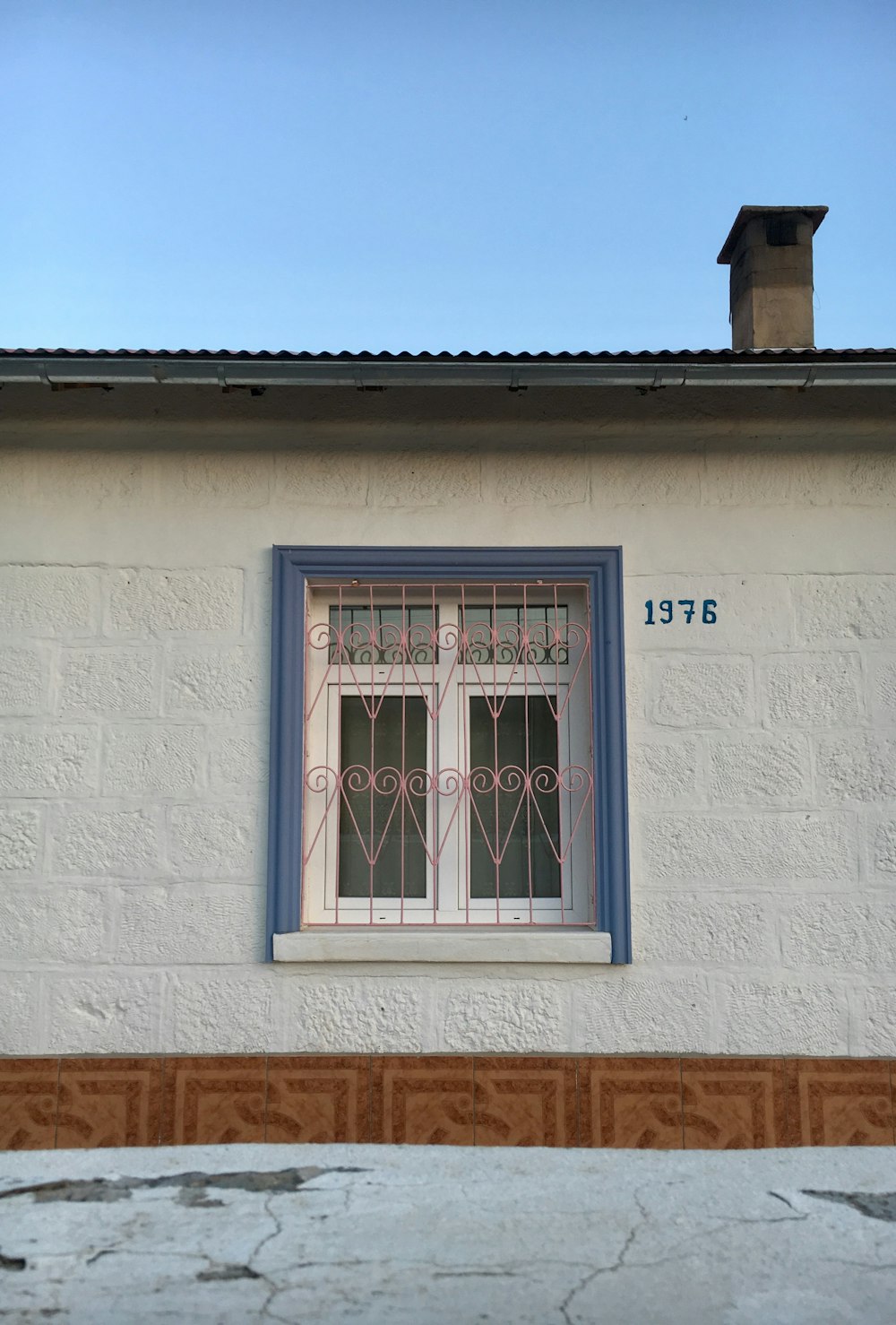 white wooden window frame on white concrete wall