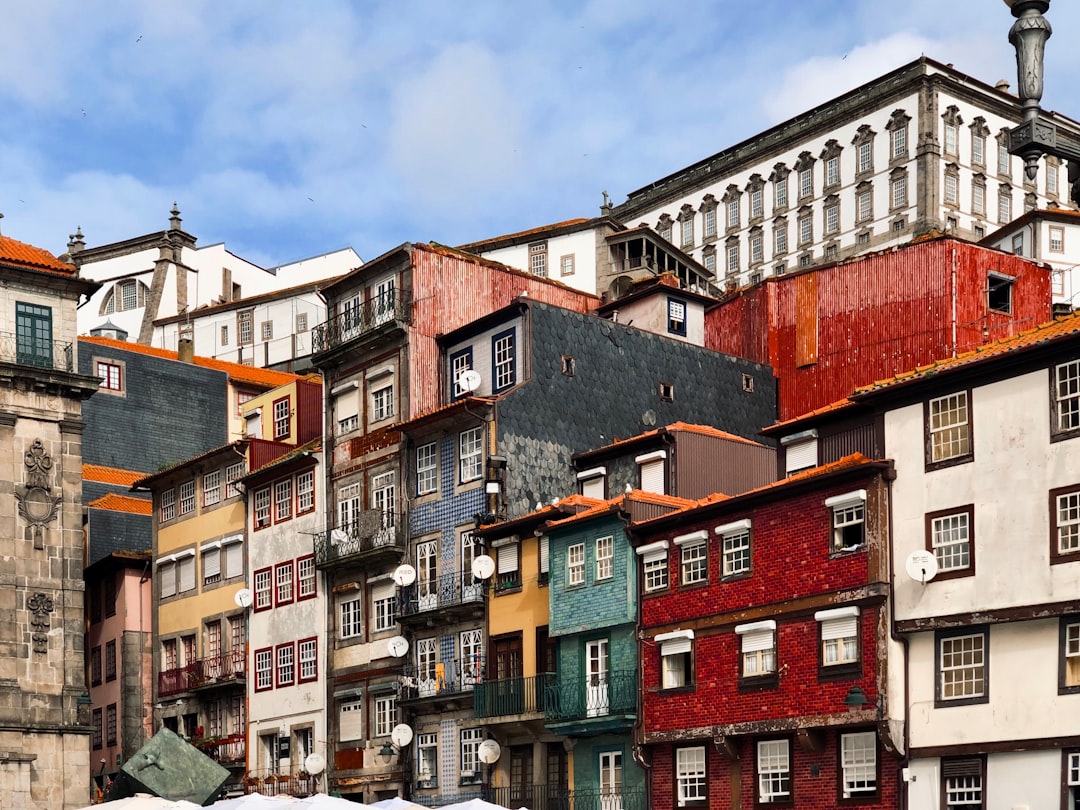 brown and green concrete buildings under blue sky during daytime