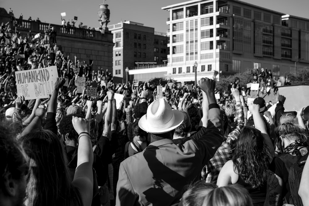 grayscale photo of people in a concert