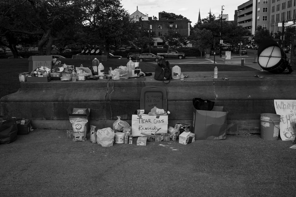 grayscale photo of people sitting on the ground