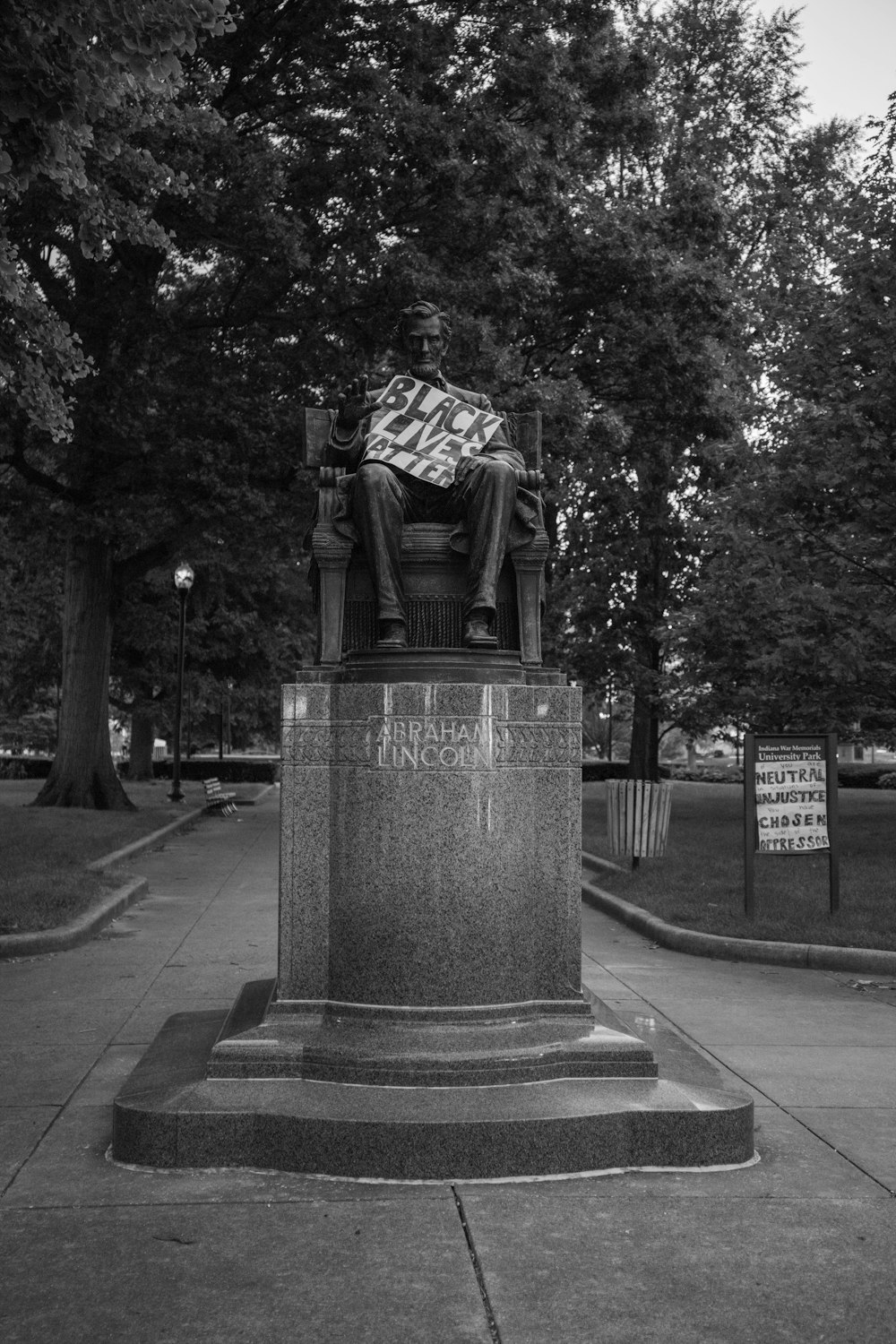 grayscale photo of statue of man