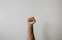 persons right foot on white wall