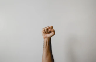 persons right foot on white wall