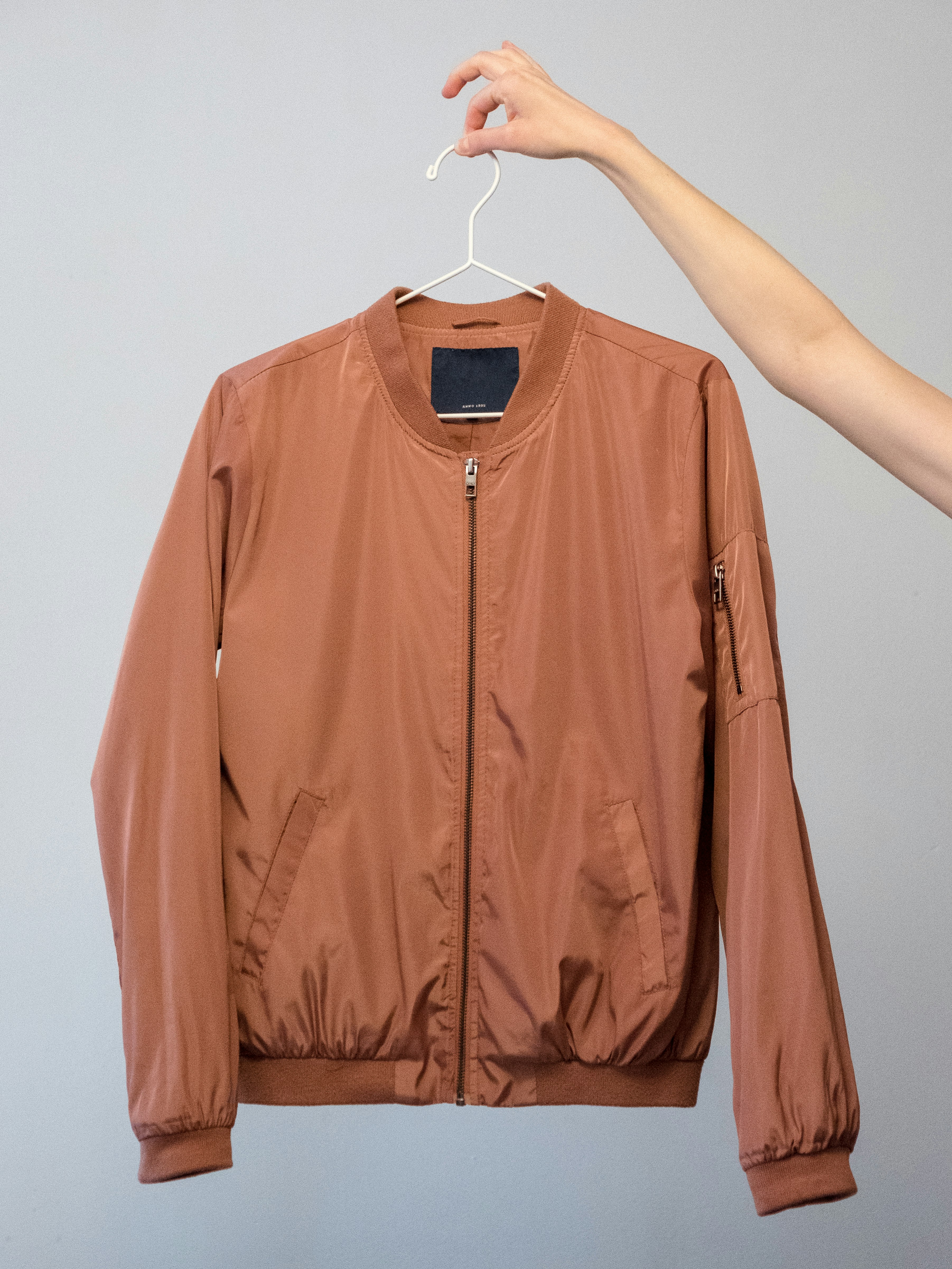 A jacket for sale on a coat hanger