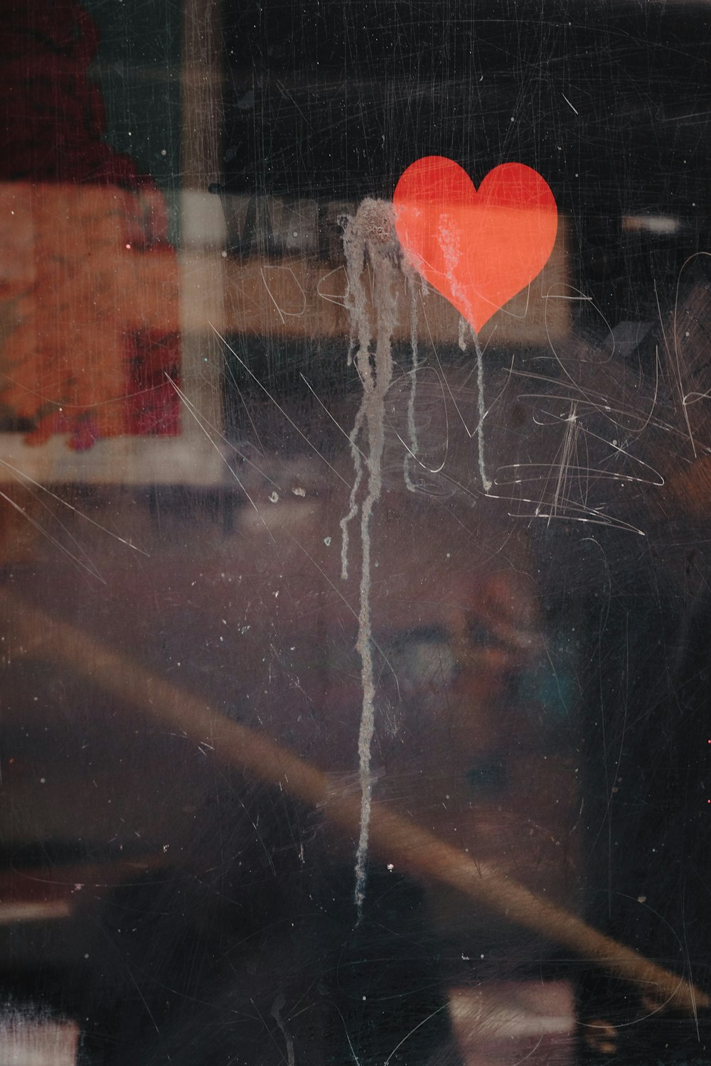 red heart on glass window