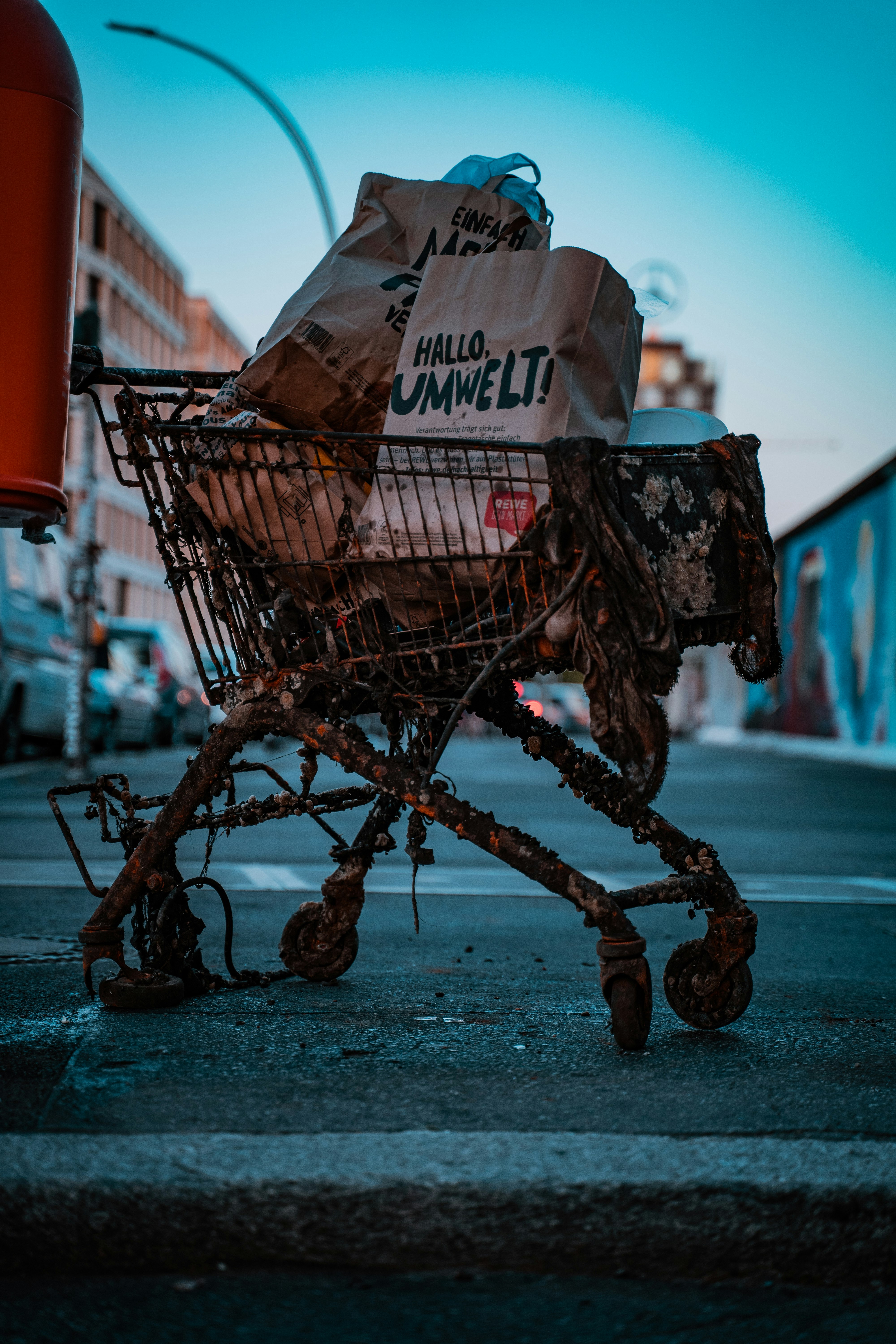 brown and black shopping bags on gray pavement