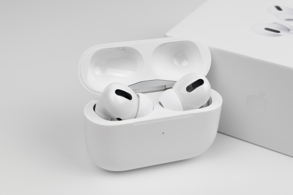 white apple earpods in white case