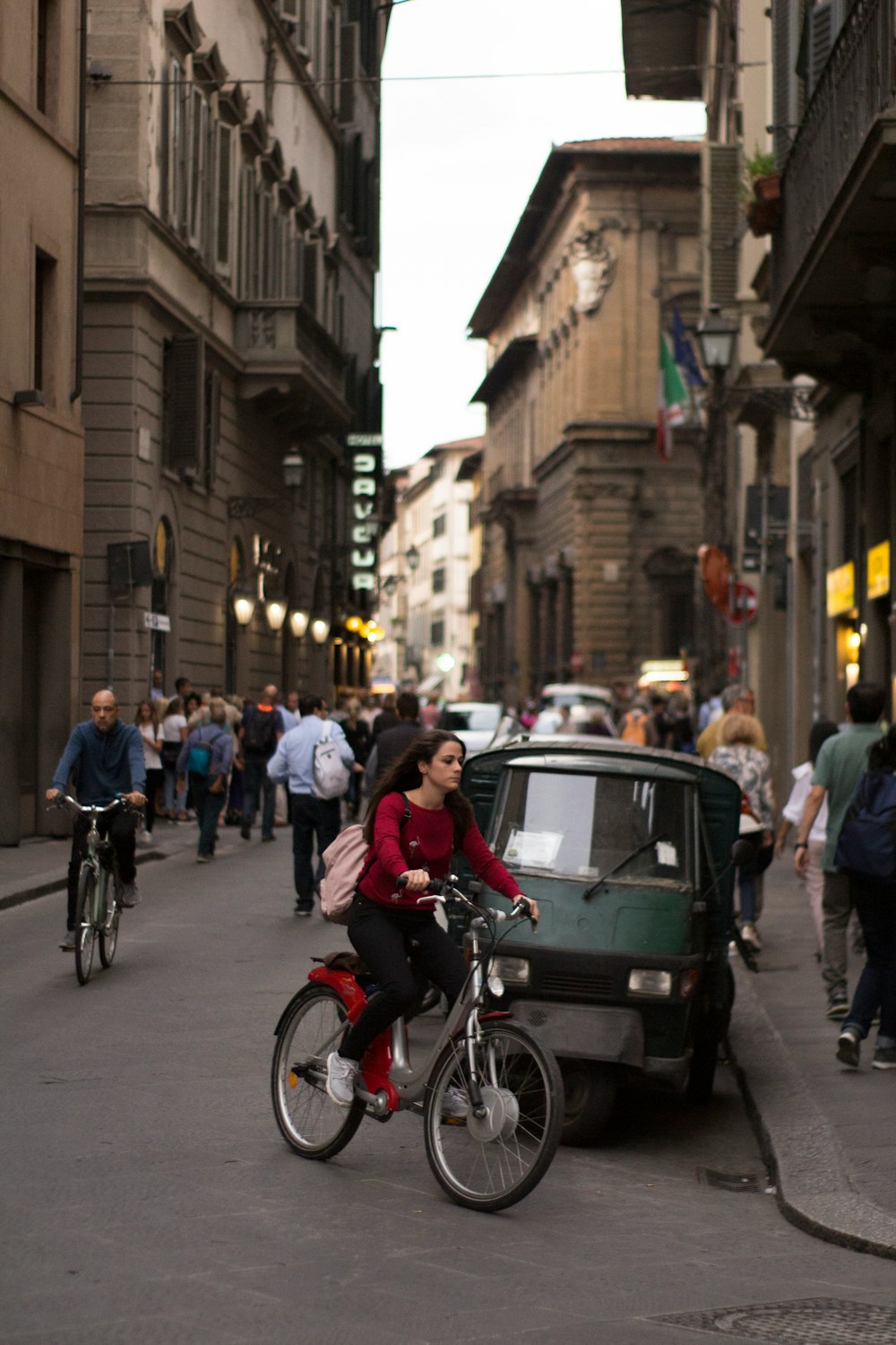 people riding bicycles on street during daytime