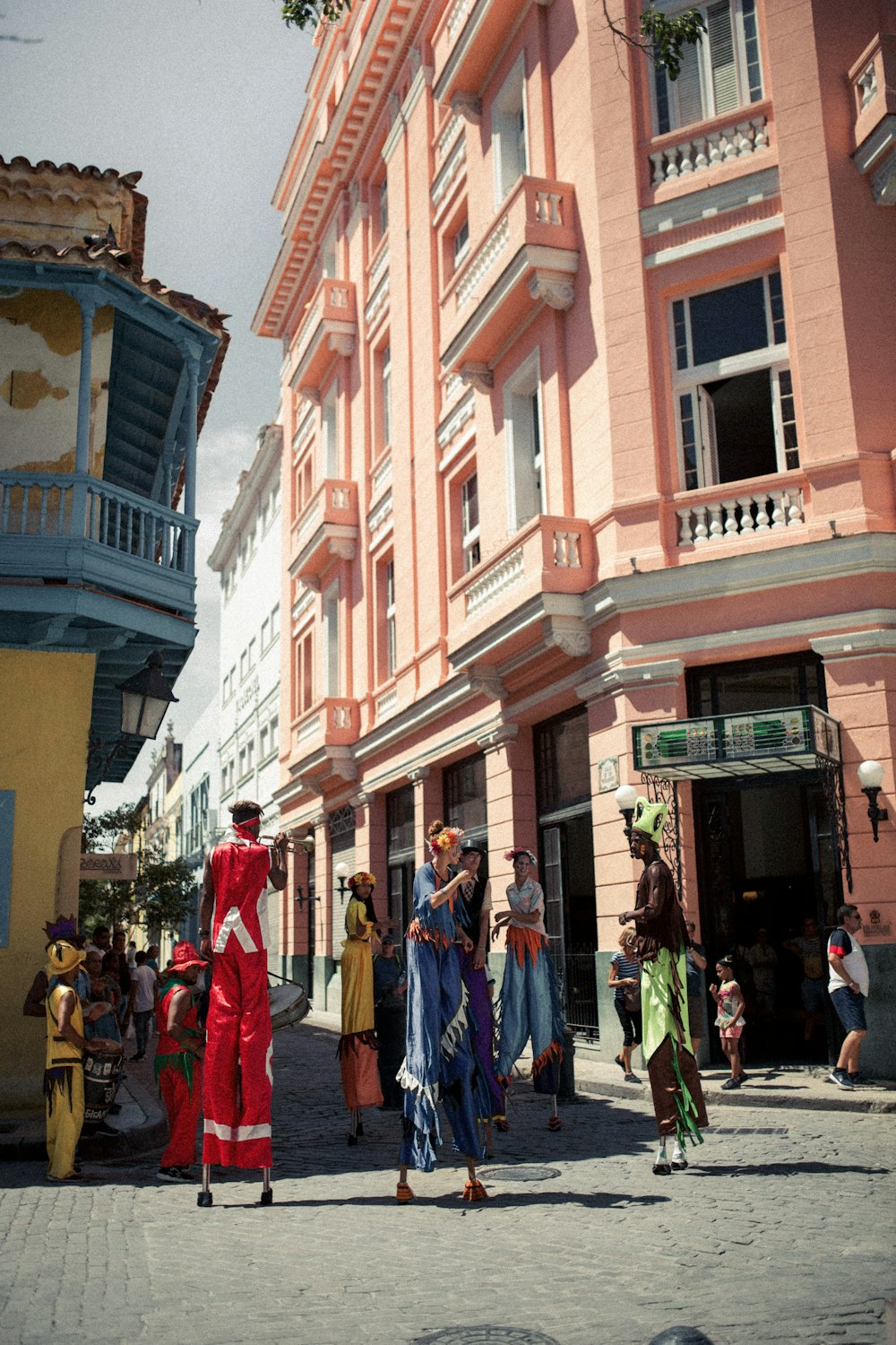 people walking on street near brown concrete building during daytime