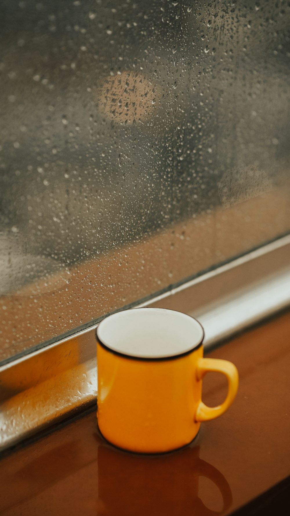 yellow and white ceramic mug