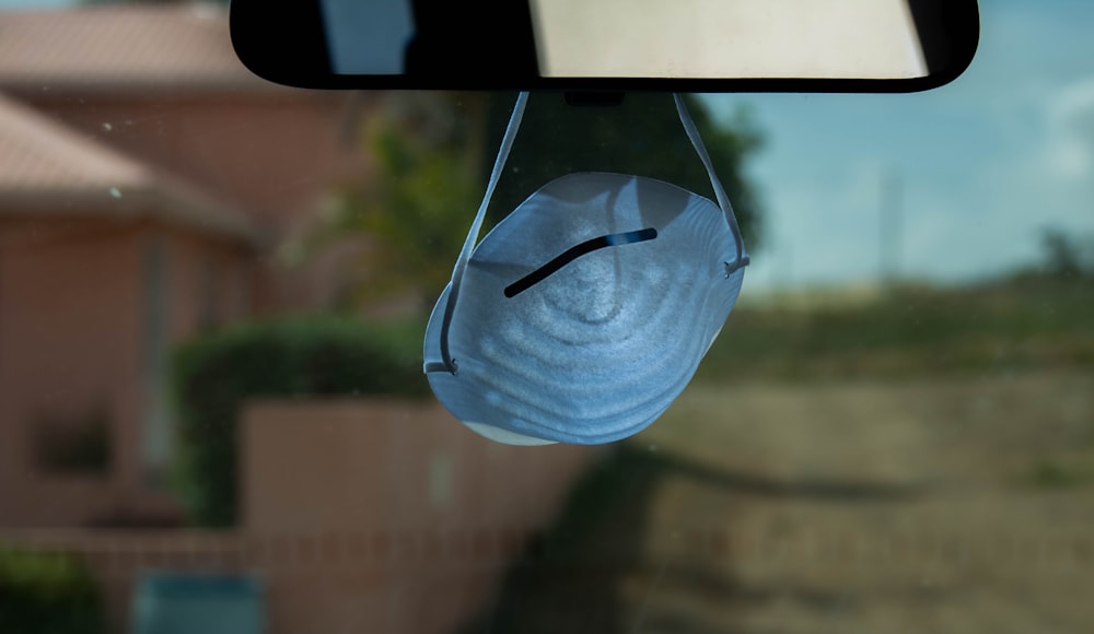 blue and black backpack on window