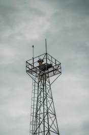 gray metal tower under gray sky