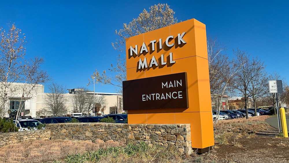 a sign for a mall in front of a parking lot